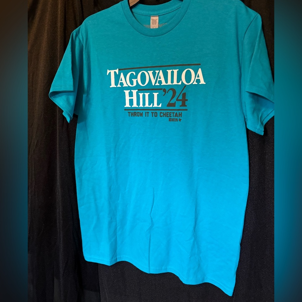 Breaking t Miami Dolphin Tagovailoa Hill '24 Teal T-Shirt